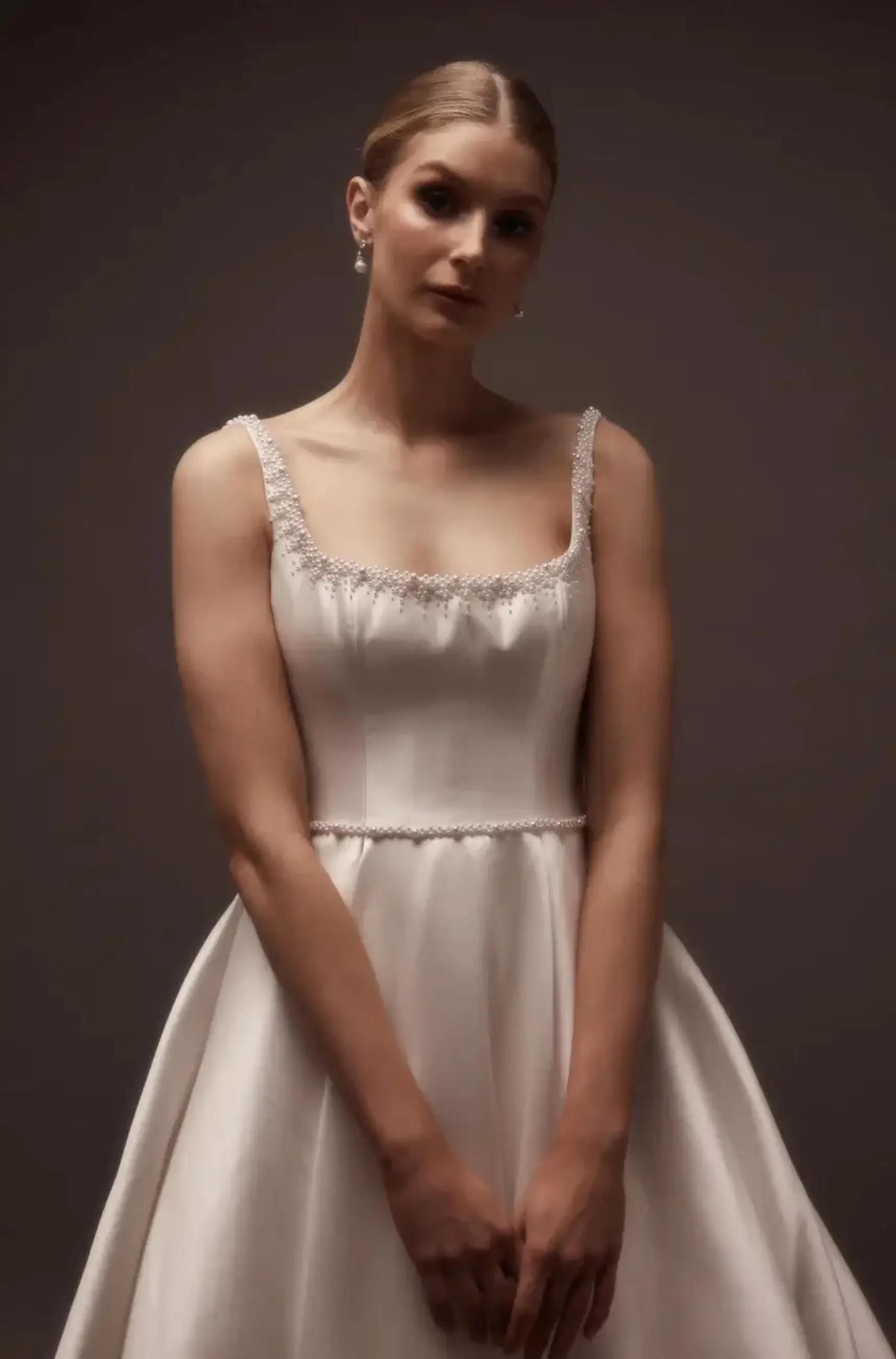 Captivating Elegance: The Rising Trend of Pearl-Detailed Wedding Dresses Image